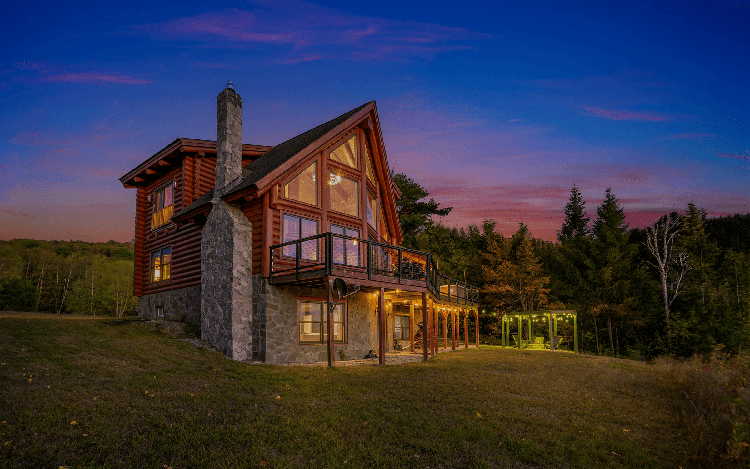 Mountain Vista Log Cabin exterior at sunset